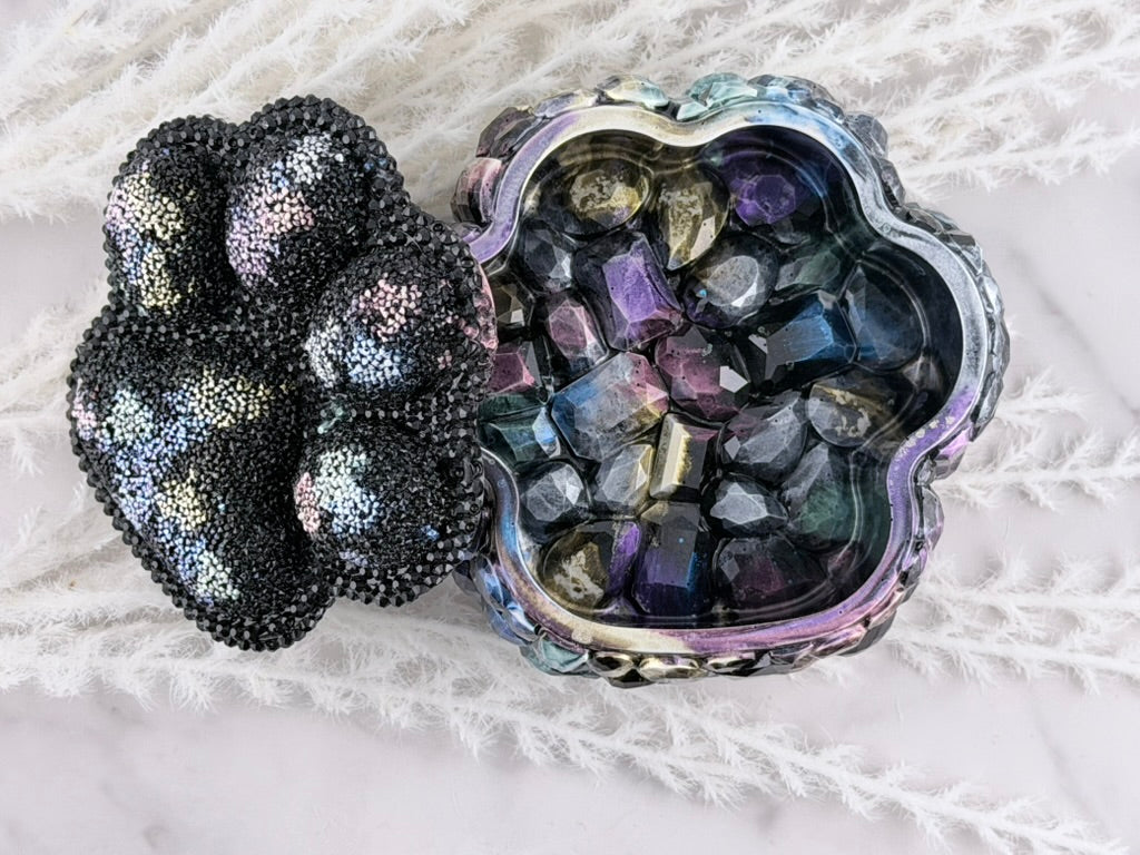 Rhinestone paw print lid resting open on the resin trinket box