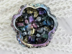 Side view of the studded resin trinket box with lid ajar