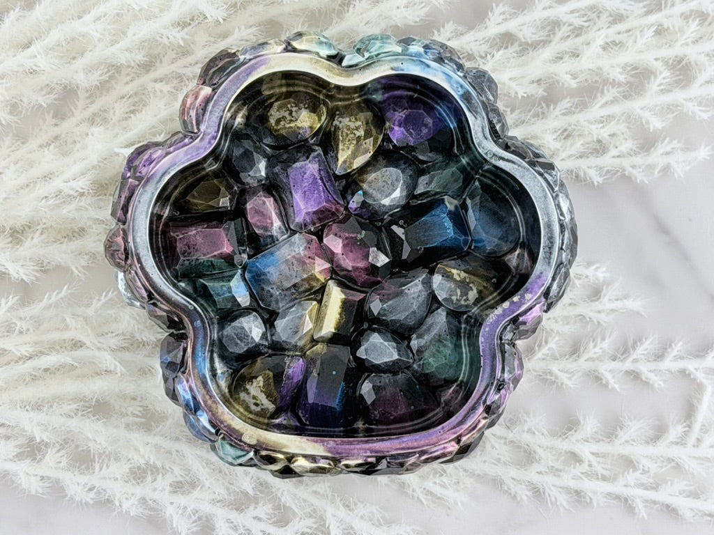 Side view of the studded resin trinket box with lid ajar