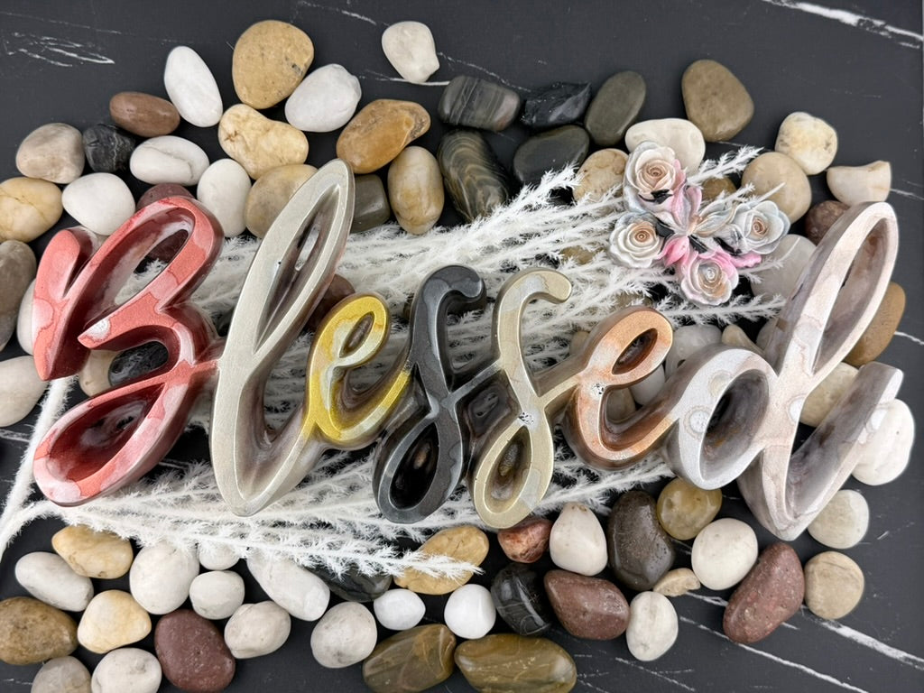 Blessed resin word sign displayed on a marble counter