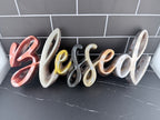 Blessed resin sign detail shot